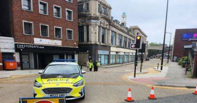 Man seriously injured in Stockport crash which saw air ambulance land before fire breaks out in building