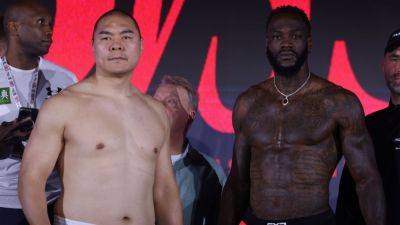 Zhilei Zhang 68.2 pounds heavier than Deontay Wilder at weigh-in - ESPN