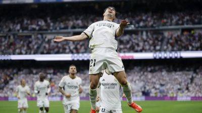 Real edge closer to LaLiga title with easy win over Cadiz