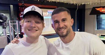 Ed Sheeran and ex Rangers star lead Ipswich Town promotion party with madcap festive sing song