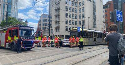 Manchester city centre tram crash LIVE as area taped off with firefighters on scene