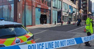 Police cordon in place outside busy Greater Manchester shopping centre after Barclays bank smashed up