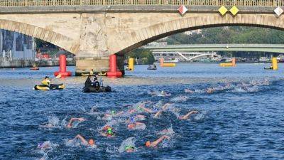 Paris Olympics organizers say swimming events still set for cleaned-up Seine River