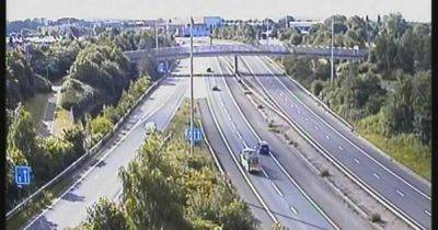M60 LIVE updates: All traffic held on stretch of motorway after 'spillage of load'