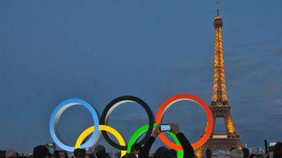 Paris Olympics - International - Volodymyr Zelenskyy - IOC gives 14 Russians, 11 Belarusians neutral status for Paris Olympics - ESPN - espn.com - Russia - Ukraine - Switzerland - Belarus