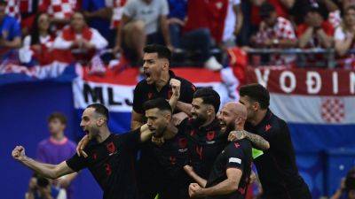 Albania fight back to deny Croatia at the death