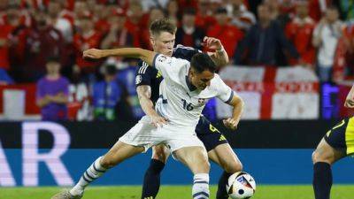 Scotland stay alive with 1-1 draw against Switzerland