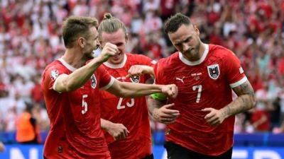 Austria ease past Poland 3-1 to renew knockout stage hopes in Euros