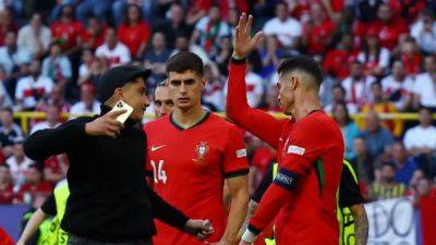 Ronaldo selfie-hunting pitch invaders are security concern, Portugal's Martinez says