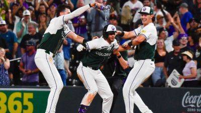 Rockies win in walk-off after bases-loaded pitch-clock violation - ESPN