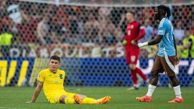 Belgium limp into knockouts as Ukraine crash out