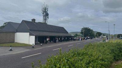 Crowds gather to pay respects to Micheál Ó Muircheartaigh