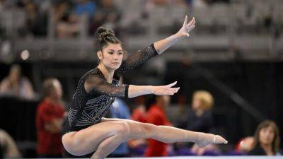 Gymnastics-Biles leads US Olympic trials, Jones and DiCello injured