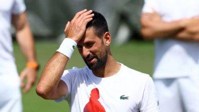 Djokovic upbeat for Wimbledon after testing knee to maximum
