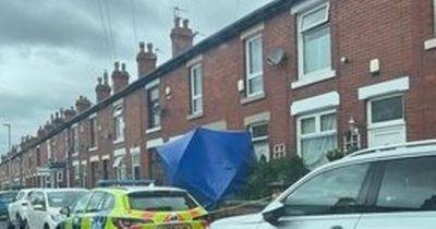 Man arrested on suspicion of attempted murder after woman stabbed at property