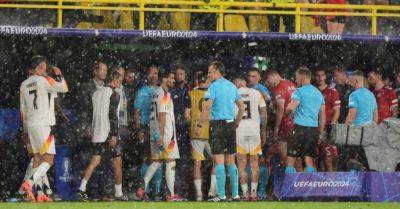 Ange Postecoglou - Michael Oliver - Germany-Denmark clash resumes after it was suspended due to torrential rain and thunder storm - breakingnews.ie - Britain - Germany - Denmark