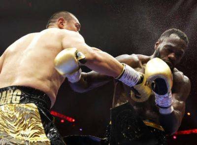 Zhilei Zhang knocks out Deontay Wilder in fifth round