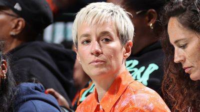 Megan Rapinoe silent as she's grilled about stance on transgender athletes in women's sports at Pride parade
