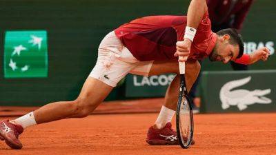 Djokovic exits French Open with serious knee injury, will lose No. 1 ranking