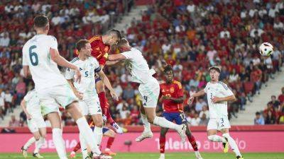 Spain overcome early scare to thrash Northern Ireland