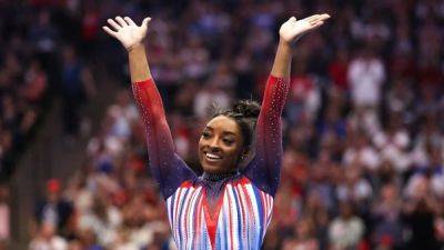 Gymnastics-Biles soars to victory at US trials to secure spot at third Games