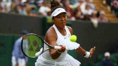 Osaka wins see-saw match to reach Wimbledon round two