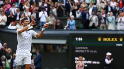 Roger Federer - Carlos Alcaraz - Novak Djokovic - Lorenzo Musetti - Holger Rune - Djokovic sees off Musetti for Wimbledon final rematch with Alcaraz - channelnewsasia.com - Serbia - Italy