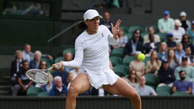 Top seed Swiatek eases into third round with no-nonsense win over Martic