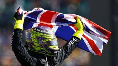 Tearful Hamilton ends long wait with record ninth British GP win