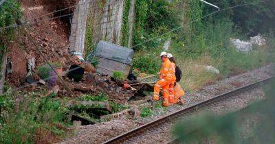 Live updates as garden wall collapses onto railway line halting all trains