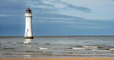 'Stunning sunset beach' with lighthouse just an hour from Manchester