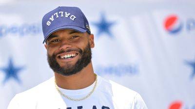 Cowboys' Dak Prescott downplays concerns about foot after walking boot pic emerges