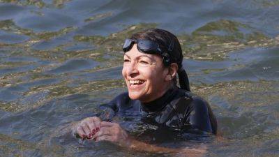 Paris mayor finally swims in Seine to prove water purity