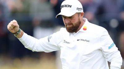 Shane Lowry keeps calm and carries British Open lead into weekend