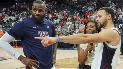 LeBron James 1st U.S. men's basketball player to carry flag in Olympics opening ceremony