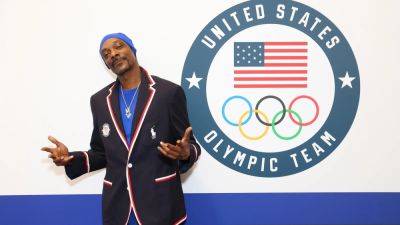 Olympic digest: Snoop Dogg to carry torch, Surf's up and Refugee team