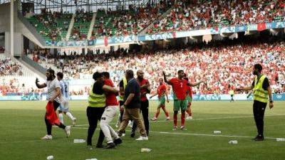 Argentina match against Morocco suspended as fans invade pitch