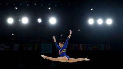 Gymnastics-Returning Olympians look forward to crowd boost