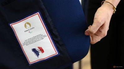 Louis Vuitton - Emmanuel Macron - Elon Musk - Paris Olympics - LVMH's luxury wares earn top billing at Olympics opening - channelnewsasia.com - France
