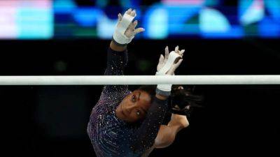 Gymnastics-US women dazzle in crystal-studded leos