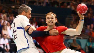 Handball-Denmark beat defending champions France in group-stage clash