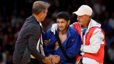 Tajikistani judoka refuses to shake hands with Israeli opponent at Paris Olympics, later withdraws over injury