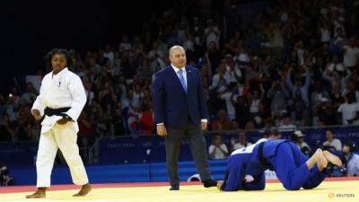 Judo-France's Cysique and Gaba reach semi-finals