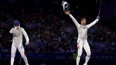 Fencing-A French fencing queen is crowned in gold at the Grand Palais