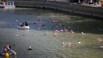 Men's Olympic triathlon postponed due to Seine water quality - ESPN