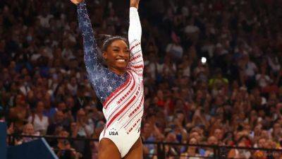 Gymnastics-Triumphant Biles leads US to gymnastics team gold