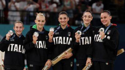 Gymnastics-Italy and Brazil celebrate breakthrough medal success in team final