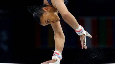 Gymnastics-Despite medal miss, Downie says she did her late brother proud