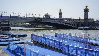 Olympic triathlons to go ahead as Seine passes water test