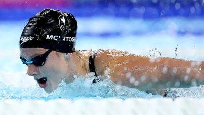 Swimmer McIntosh conserves energy in qualifying 6th for Olympic 200m butterfly semifinals